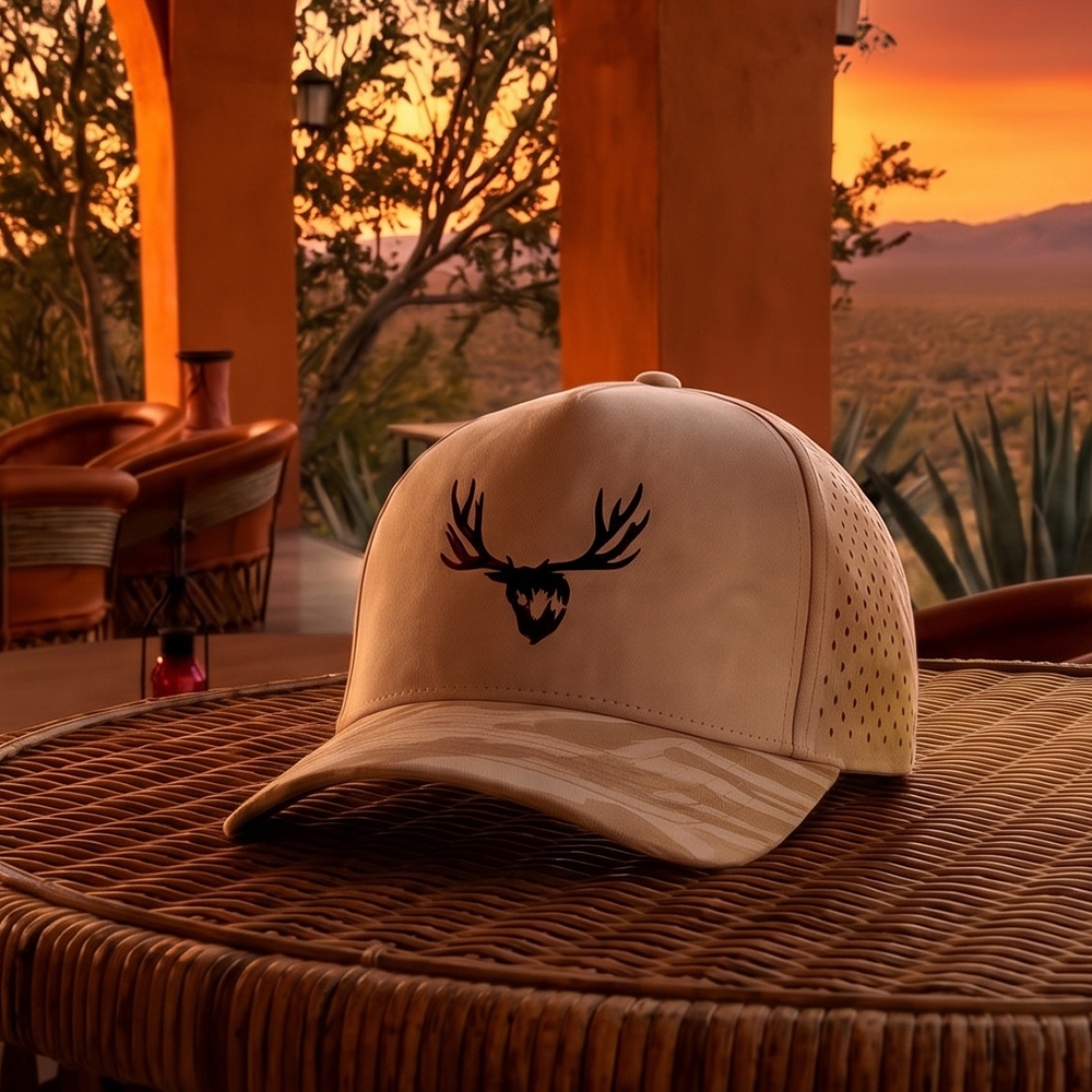 Custom tan 5 panel hat with embroidered El Chaparral Ranch logo and custom visor print